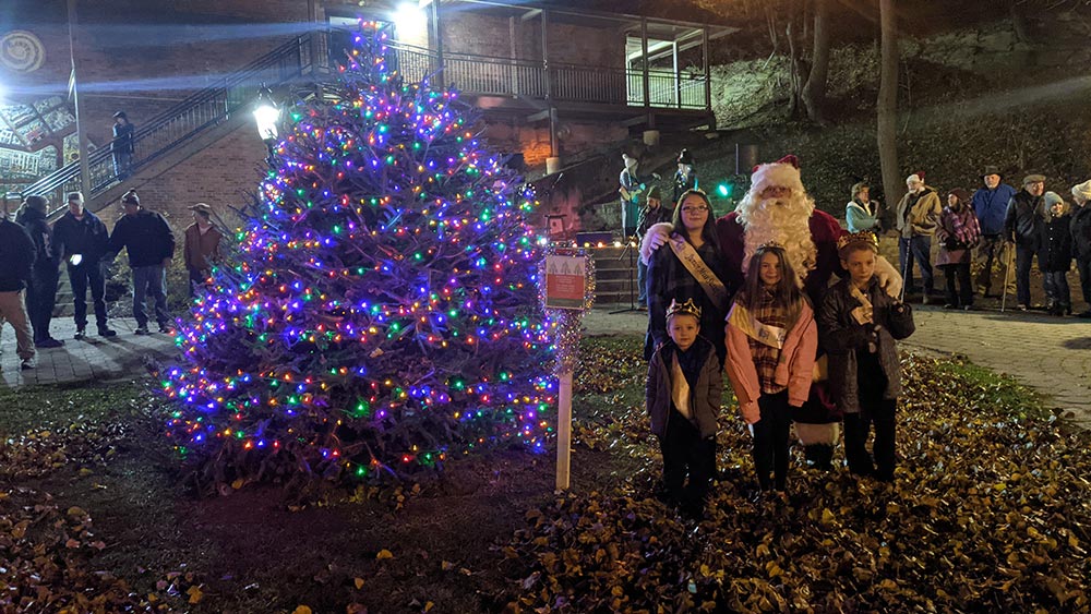 Lit tree with santa